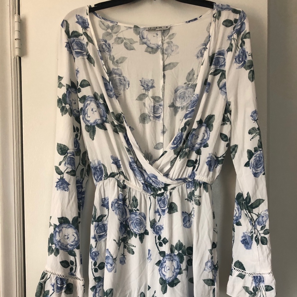Floral flowy romper with button adjustment